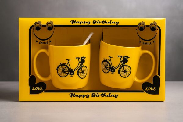 হ্যাপি বার্থডে স্মাইল মগ গিফট সেট – ইয়েলো সিরামিক কাপল মগ বাইসাইকেল ডিজাইনে – জন্মদিনের উপহার